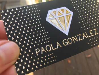 Picture of real estate business cards with raised gold foil