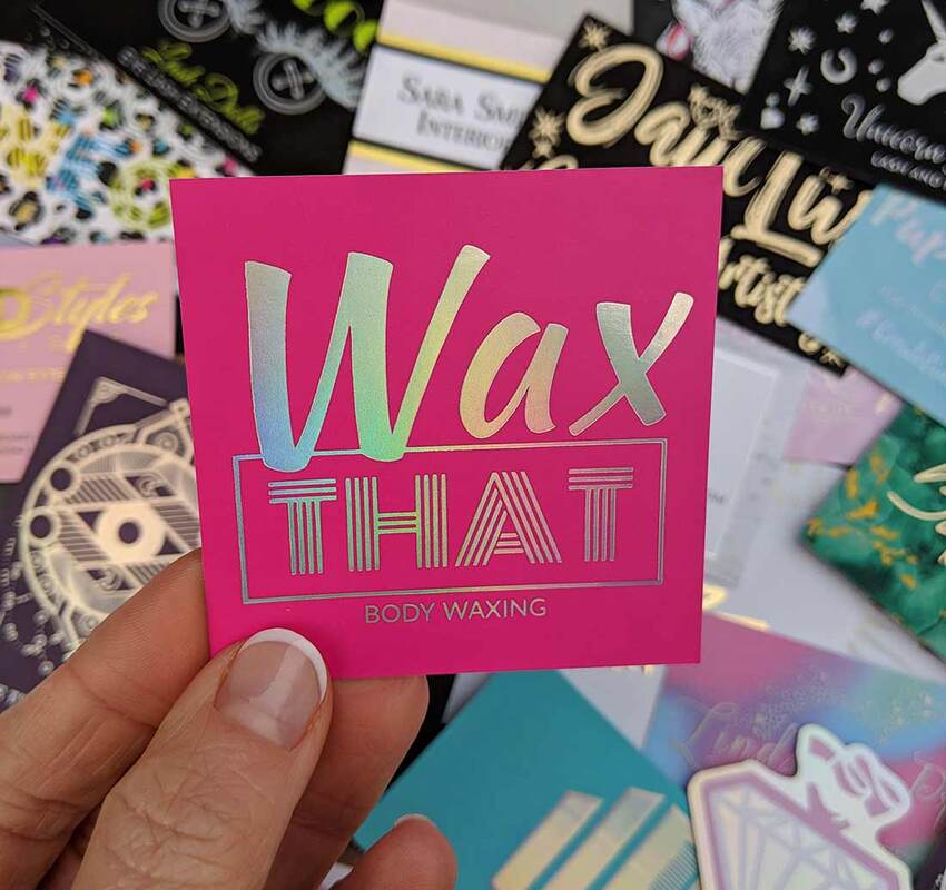 Hot pink square business cards with holographic foil added to both sides. Super fun font based logo for this body waxing salon. 