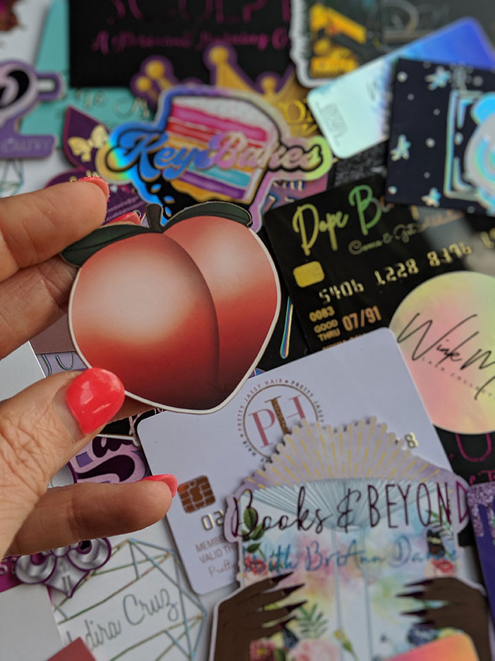 Custom shaped business cards for full body wax artist, Amanda Crovo. These die cut business cards are in the shape of the popular peach emoji. The highlights on the design make for a very perky peach. ;) On the backside is all of her contact information in holographic foil.